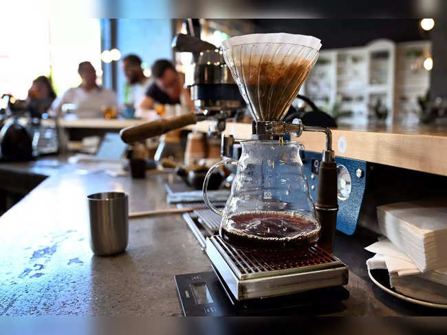 This photo taken on February 9, 2023 shows coffee being filtered at the Proud Mary cafe in Melbourne. At 140 USD a pop, one cafe in Melbourne, Australia is serving up no ordinary cup of joe. The city has long been famed for its coffee culture, with Italian and Greek migrants infusing the city with all things bean and cup since the 1940s. - To go with AFP story Australia-culture-coffee, by Melissa Iaria (Photo by William WEST / AFP) / To go with AFP story Australia-culture-coffee, by Melissa Iaria