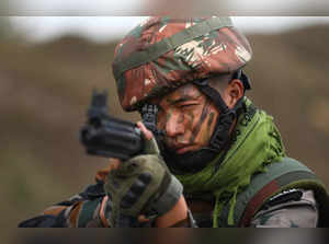 Akhnoor: Indian Army soldier during a drill at firing range at Line of Control (...