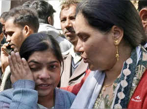 New Delhi: Residents in tears during an anti-encroachment drive by Delhi Development Authority (DDA) at Mehrauli in New Delhi, India on Tuesday, Feb. 14, 2023. (Photo: Wasim Sarvar/IANS)