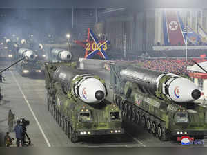 Kim Jong Un shows off daughter, missiles at N. Korean parade