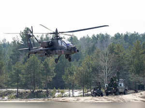 Adazi : A U.S. Boeing AH-64 Apache attack helicopter flies during the NATO milit...