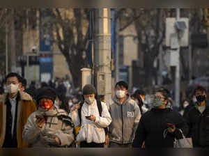 China says 200 million treated, pandemic 'decisively' beaten