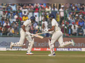 New Delhi: Indian batters Axar Patel and Ravichandran Ashwin run between the wic...