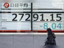 Asia shares muted by unease over Fed, BOJ policy