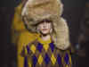 Burberry ditch signature trench coats for faux fur, feathers and duck prints in new catwalk show