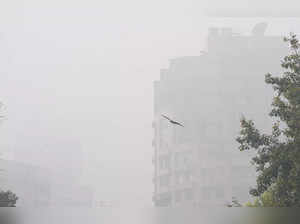 New Delhi: Fog engulfs buildings at Connaught Place amid fog in New Delhi. (PTI ...