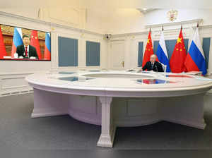 FILE PHOTO: Putin and Xi hold talks via videolink