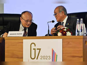 CORRECTION / Japan’s Finance Minister, Shunichi Suzuki (R) and Vice Minister of Finance, International Affairs, Masato Kanda addresses a presser on G7 Finance Ministers and Central Bank Governors Meeting, on the sidelines of G20 Finance Ministers and Central Bank Governors meeting under India’s G20 Presidency in Bengaluru on February 23, 2023. (Photo by Manjunath KIRAN / AFP)