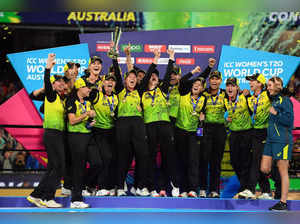 (FILES) In this file photo taken on March 8, 2020, Australia players celebrate with the winning trophy of Twenty20 women's cricket World Cup after beating India in the final in Melbourne Defending champions Australia have undergone significant changes in their squad but remain the team to beat in the Women’s T20 World Cup which starts in Cape Town on February 10, 2023. - -- IMAGE RESTRICTED TO EDITORIAL USE - STRICTLY NO COMMERCIAL USE -- (Photo by William WEST / AFP) / -- IMAGE RESTRICTED TO EDITORIAL USE - STRICTLY NO COMMERCIAL USE --