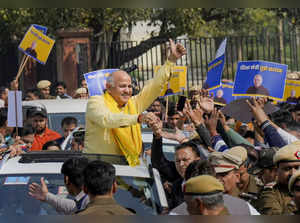 New Delhi: Delhi Deputy Chief Minister Manish Sisodia waves at supporters as he ...
