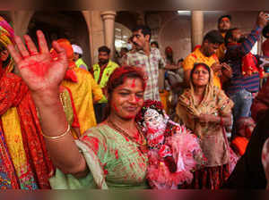 Mathura: Holi players daubed in colours during the 'Ladoo Holi' celebrations at ...