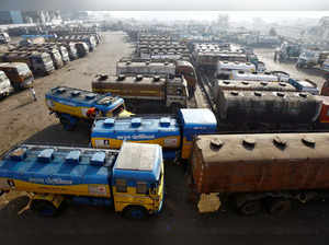 FILE PHOTO: Oil tankers are seen parked at a yard outside a fuel depot on the outskirts of Kolkata