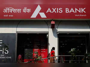 A customer enters a branch of Axis Bank in Mumbai