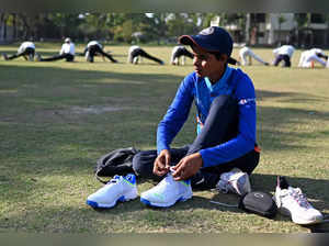 In this photograph taken on February 20, 2023, Indian cricketer Sonam Yadav arrives for a net practice at a ground in Firozabad in Uttar Pradesh state. Yadav could not afford sports shoes when she was younger but now the 15-year-old is set to play in India's Women's Premier League and says the money will transform life for her family. - To go with 'Cricket-Women-IND-WPL', FOCUS by Abhaya SRIVASTAVA (Photo by Sajjad HUSSAIN / AFP) / To go with 'Cricket-Women-IND-WPL', FOCUS by Abhaya SRIVASTAVA