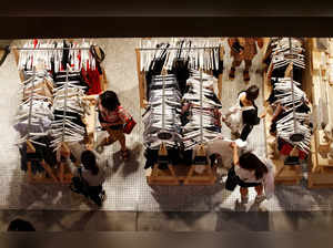 FILE PHOTO: Women shop for clothes on a store in a shopping mall in Sydney