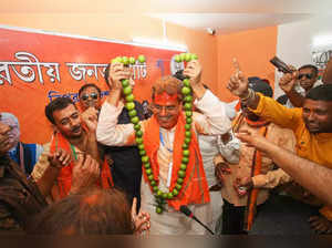 Agartala_ Tripura Chief Minister Manik Saha being garlanded by BJP supporters af....