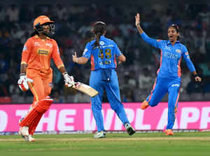 Navi Mumbai: Mumbai Indians players Amelia Kerr with teammates celebrates the wi...