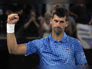 Novak Djokovic of Serbia reacts after defeating Alex de Minaur of Australia in t...