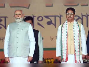 Agartala: Prime Minister Narendra Modi with newly sworn Tripura Chief Minister Manik Saha during the swearing in ceremony of Tripura CM and cabinet ministers in Agartala on Wednesday, March 08, 2023. (Photo:Abhisek Saha/IANS)