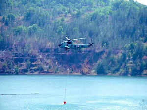 Indian Navy helicopters engaged in dousing Goa forest fire