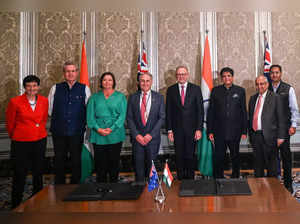 (L-R) Chief Executive of Business Council of Australia (BCA) Jennifer Westacott, High Commissioner of Australia to India Barry O' Farrell, Minister for Resources of Australia Madeleine King, Australian Senator and Minister for Trade and Tourism Don Farrell, Australia's Prime Minister Anthony Albanese, Indian Minister of Commerce and Industry Piyush Goyal, Director General of the Confederation of Indian Industry Chandrajit Banerjee and High Commissioner of India to Australia Manpreet Vohra pose after signing a partnership agreement at a meeting in Mumbai on March 9, 2023.  (Photo by Indranil MUKHERJEE / AFP)