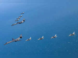 This handout photo taken and provided on February 19, 2023 by the South Korean Defence Ministry in Seoul shows US Air Force B-1B bombers (L), South Korea's Air Force F-35A fighter jets (top) and US Air Force F-16 fighter jets (bottom) flying over the South Korea Peninsula during a joint air drill in South Korea. North Korea said on February 19 that it had test-fired an intercontinental ballistic missile as a warning to Washington and Seoul, saying the successful "surprise" drill demonstrated Pyongyang's capacity to launch a "fatal nuclear counterattack". In response, the US and South Korea staged joint air