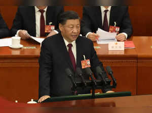 Chinese President Xi Jinping delivers a speech at the closing ceremony for China...