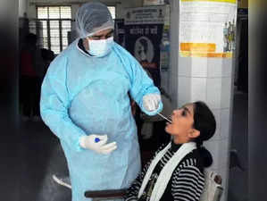 New Delhi: A health worker collects a swab sample from a woman for Covid-19 test as coronavirus cases in some countries, in New Delhi on Monday, Jan. 02, 2023. India has made the RT-PCR test mandatory for international passengers. (Photo: Qamar Sibtain/IANS)