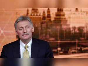 Kremlin spokesman Dmitry Peskov listens during Russian President Vladimir Putin's annual end-of-year news conference in Moscow