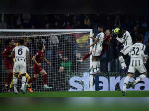Juventus' French midfielder Paul Pogba (Top R) goes for a header  during the Italian Serie A football match between AS Roma and Juventus on March 5, 2023 at the Olympic stadium in Rome. (Photo by Filippo MONTEFORTE / AFP)