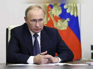 FILE - Russian President Vladimir Putin speaks to Governor of Magadan Region Ser...