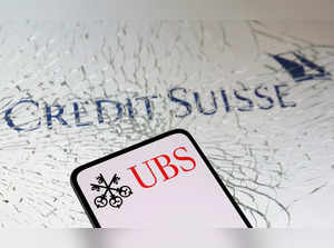 Illustration shows UBS Group and Credit Suisse logos