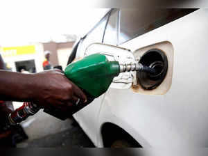 FILE PHOTO: An employee pumps fuel into a car at a Shell petrol station in Nairobi