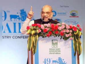 Gandhinagar: Union Home Minister Amit Shah addresses during the 49th Dairy Industry Conference, in Gandhinagar, on Saturday, March 18, 2023. (Photo:IANS/Twitter)