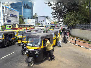 Thiruvananthapuram: Auto-rickshaw drivers during their protest against the fuel ...