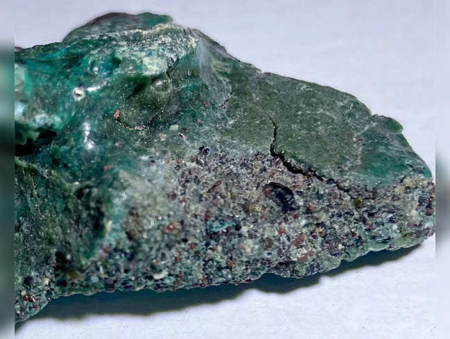 This handout picture released by the Parana Federal University (UFPR) shows "plastic rocks" found at the Trindade Island, Espirito Santo state, Brazil, on September 2, 2022, that are part of a scientific research handled by scientists of the UFPR.  There are few places on Earth as isolated as Trindade island, a volcanic outcrop a three- to four-day boat trip off the coast of Brazil. So geologist Fernanda Avelar Santos was startled to find an unsettling sign of human impact on the otherwise untouched landscape: rocks formed from the glut of plastic pollution floating in the ocean. - RESTRICTED TO