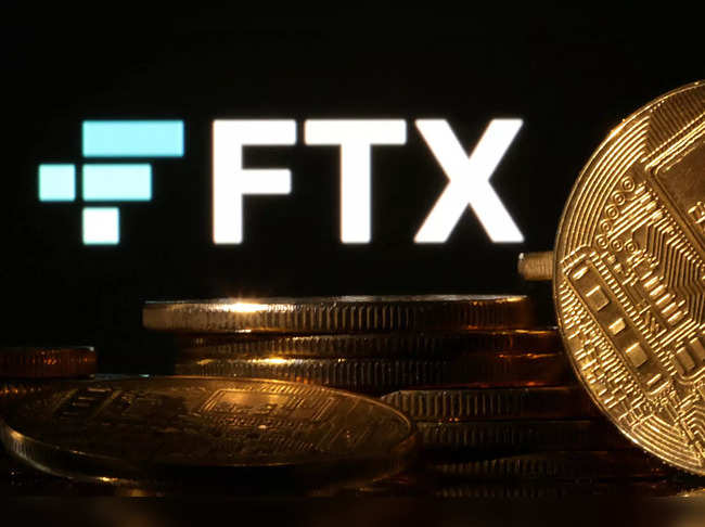 FILE PHOTO: Illustration shows FTX logo and representation of cryptocurrencies