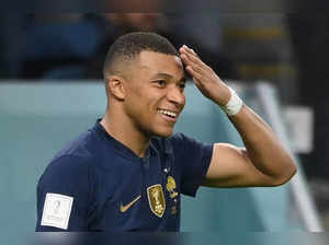 (FILES) In this file photo taken on November 22, 2022 France's forward #10 Kylian Mbappe celebrates after he scored during the Qatar 2022 World Cup Group D football match between France and Australia at the Al-Janoub Stadium in Al-Wakrah, south of Doha.    France's head coach Didier Deschamps named Paris Saint-Germain's French forward Kylian Mbappe, 24, new captain of Les Bleus according to a source close to the French team, on March 20, 2023. (Photo by FRANCK FIFE / AFP)