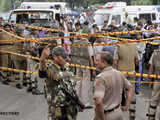 Police cordon off the site of a bomb blast outside Delhi High Court