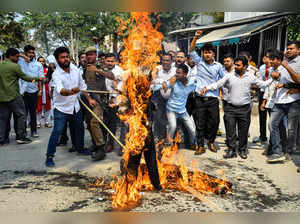 Guwahati: Activists of All Assam Students' Unions (AASU) burn an effigy during a...