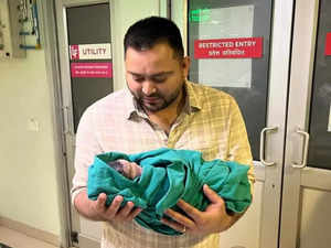 Tejashwi Yadav and his baby daughter (Twitter)