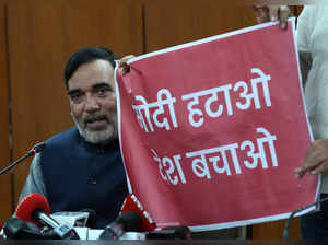 Delhi Minister Gopal Rai shows a poster that reads 'Modi Hatao, Desh ...