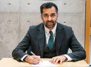 Newly elected leader of the Scottish National Party (SNP), Humza Yousaf signs the nomination form to become First Minister for Scotland at the Scottish Parliament in Edinburgh, on March 28, 2023 ahead of the MP's vote concerning his nomination to be Scotland's sixth First Minister.  (Photo by Jane Barlow / POOL / AFP)