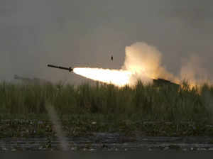 A U.S. M142 High Mobility Artillery Rocket System (HIMARS) fires a missile durin...