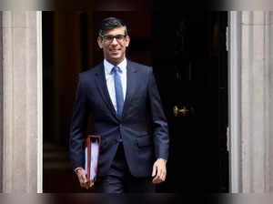 FILE PHOTO: British Prime Minister Rishi Sunak walks on Downing Street in London