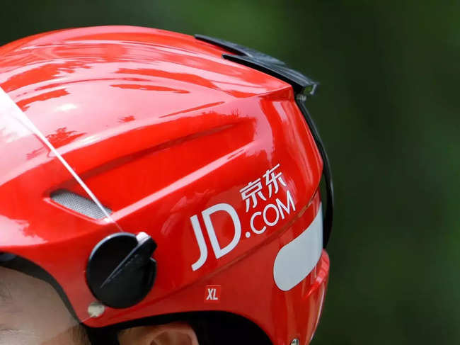 FILE PHOTO_ Logo of JD.com is seen on a helmet of a delivery man in Beijing.