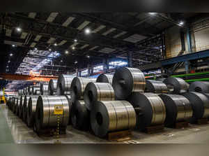 (FILES) This file photo taken on April 25, 2019 shows coils of galvanized steel stacked at steel manufacturing giant Arcelor-Mittal's Eko Stahl steelworks in Eisenhuettenstadt, eastern Germany. The steel industry sector in Germany is one of the most affected by shortages of skilled workers. Facing this challenge, the German government is to adopt a bill on March 29, 2023 aimed at relaxing rules for immigrants to obtain visas and work permits. (Photo by John MACDOUGALL / AFP) / TO GO WITH AFP STORY by Sebastien ASH