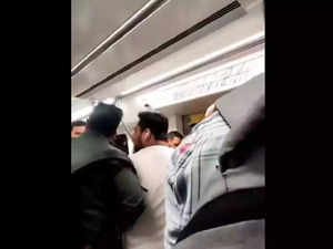Chaos in Delhi Metro; Two men fight and threaten each other over seat inside the metro, See clip here