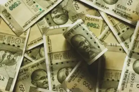 Rupee weakens to U.S. dollar after RBI keeps rate unchaged.