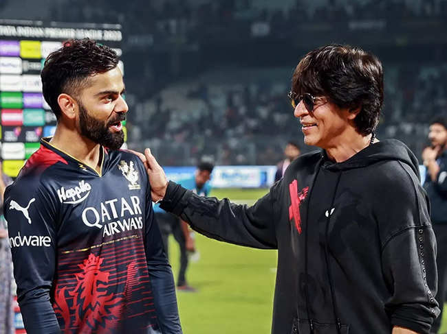 ​Shah Rukh Khan and Virat Kohli share a light moment on field after the intense IPL match.